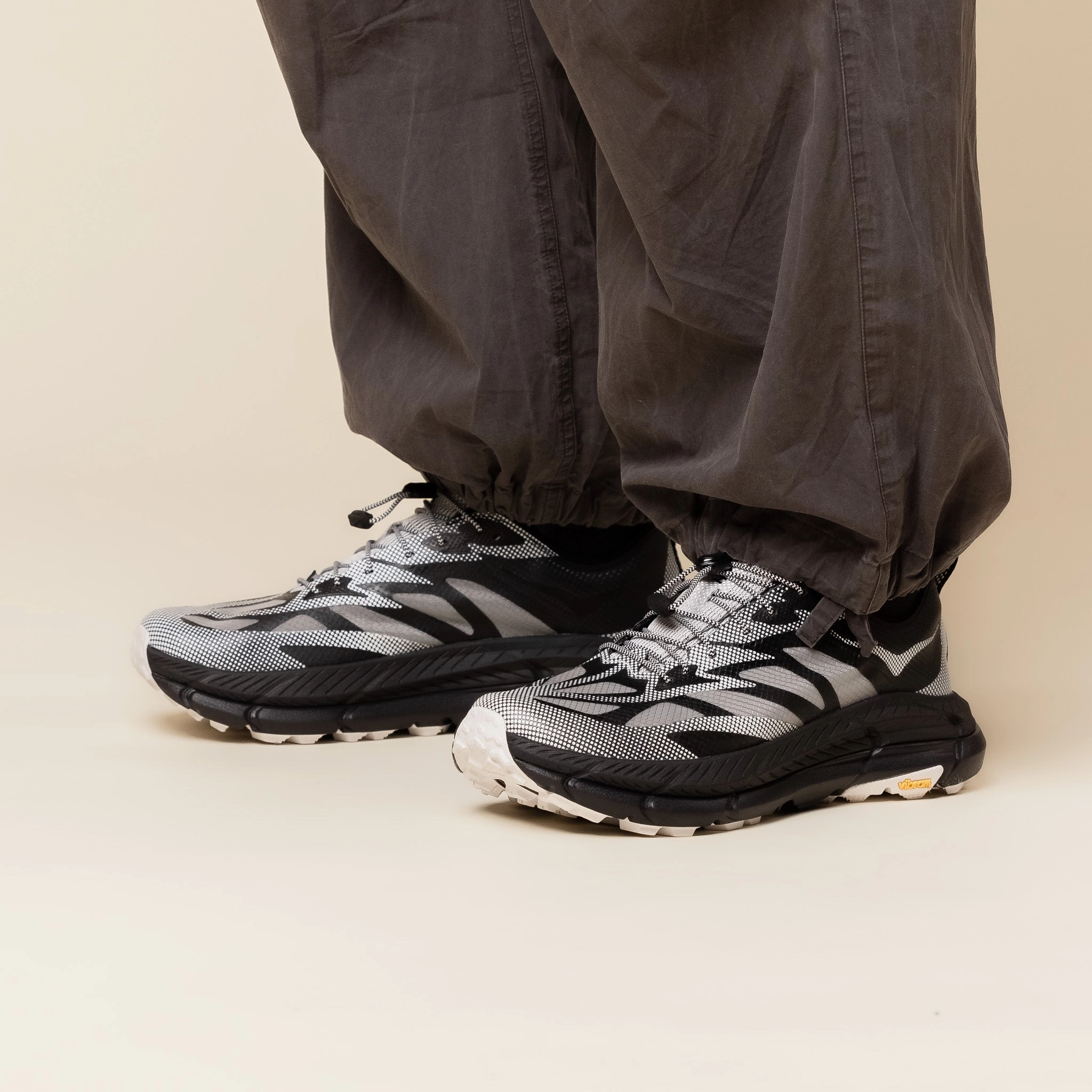 Half   Size Available Hoka - Stealth Tech Mafate Speed 4 Lite - Black / White